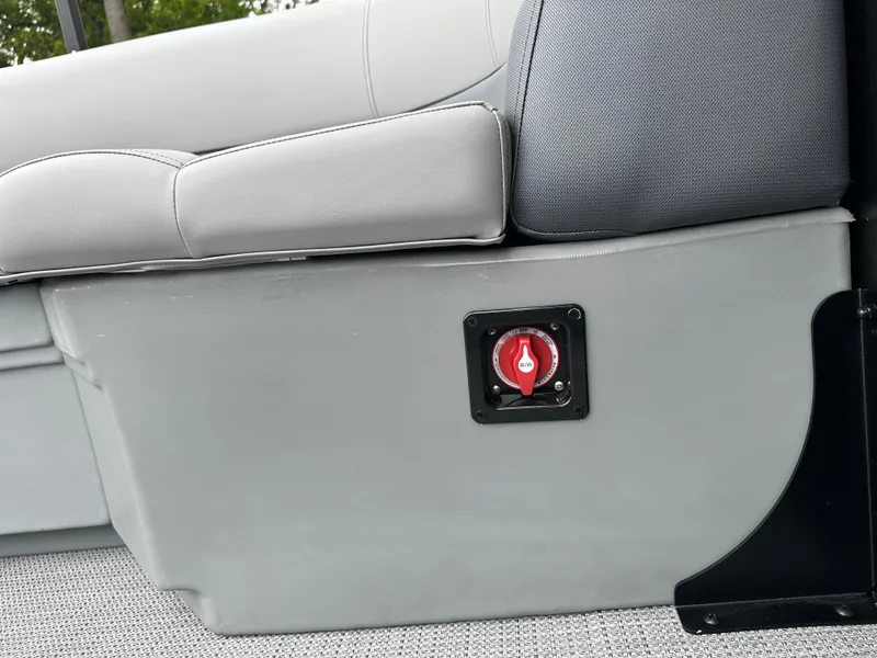 Slide: The Image of 2025 Bentley Pontoons Legacy 220 Navigator interior detail with red switch on gray panel. - 21