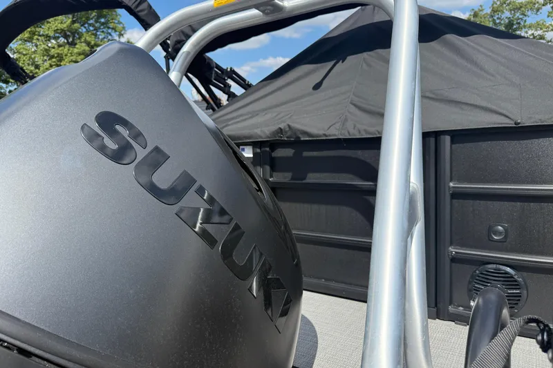 Slide: The Image of 2025 Bentley Pontoons Legacy 220 Navigator with Suzuki engine, close-up view. - 4