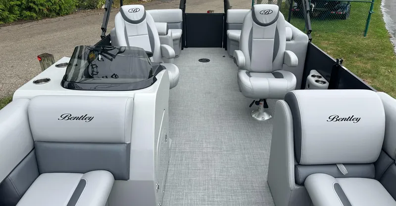 Slide: The Image of 2025 Bentley Pontoons Legacy 220 Navigator interior with luxurious seating and modern design. - 7