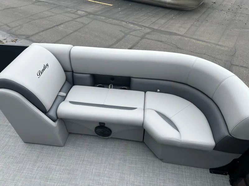 Slide: The Image of 2025 Bentley Pontoons Legacy 220 Navigator interior with sleek gray seating and modern design. - 9