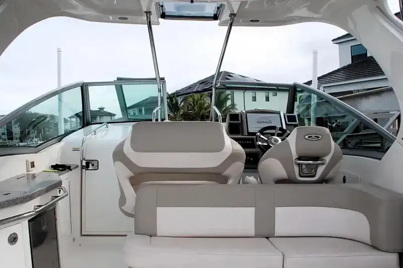 Slide: The Image of 2017 Chaparral 310 Signature boat interior with modern helm and seating. - 12