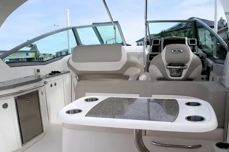 Slide: The Image of 2017 Chaparral 310 Signature boat interior with seating and helm. - 14