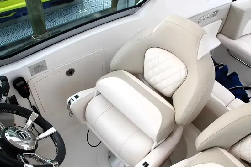 Slide: The Image of Luxurious interior of 2017 Chaparral 310 Signature boat with plush seating and steering wheel. - 20