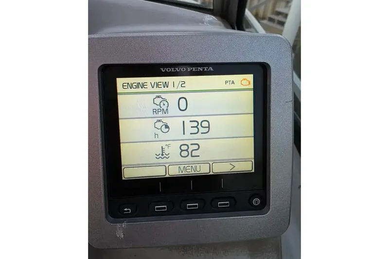 Slide: The Image of Volvo Penta engine display on 2017 Chaparral 310 Signature, showing RPM, hours, and temperature. - 25