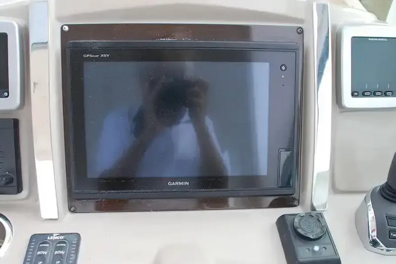 Slide: The Image of Control panel of 2017 Chaparral 310 Signature with Garmin GPSmap XSV display. - 26