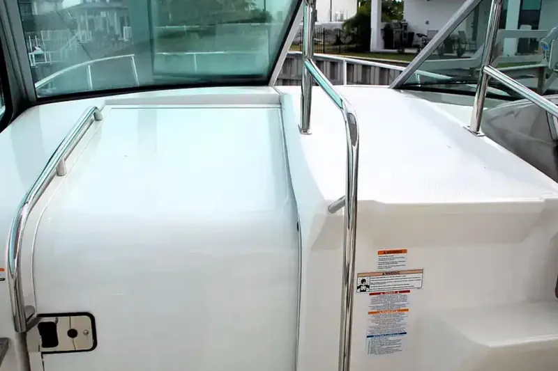 Slide: The Image of 2017 Chaparral 310 Signature boat deck with stainless steel railings. - 27