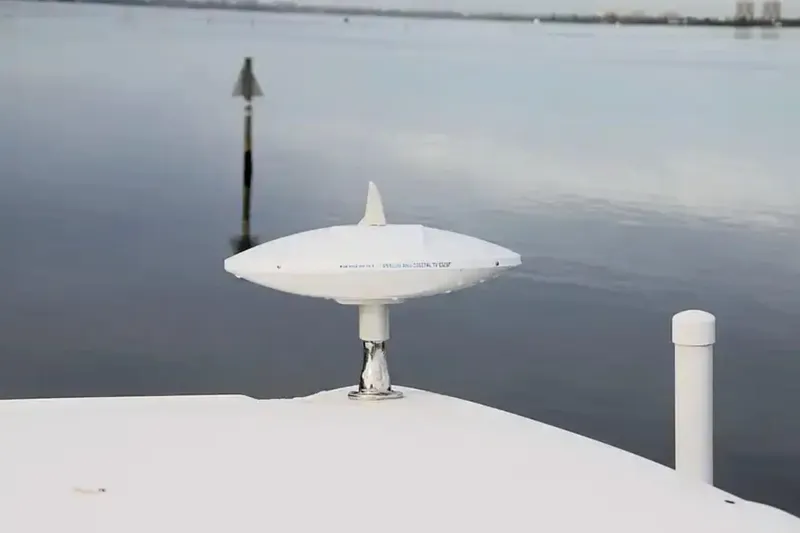 Slide: The Image of 2017 Chaparral 310 Signature boat with radar on calm water background. - 31