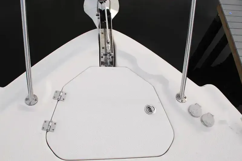 Slide: The Image of 2017 Chaparral 310 Signature boat deck with anchor hatch and railing. - 36