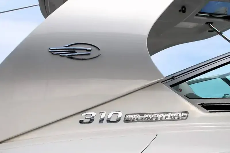 Slide: The Image of 2017 Chaparral 310 Signature boat logo and model name on hull. - 37