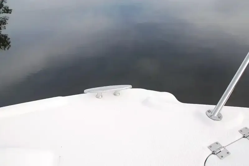 Slide: The Image of Bow of 2017 Chaparral 310 Signature boat on calm water. - 38