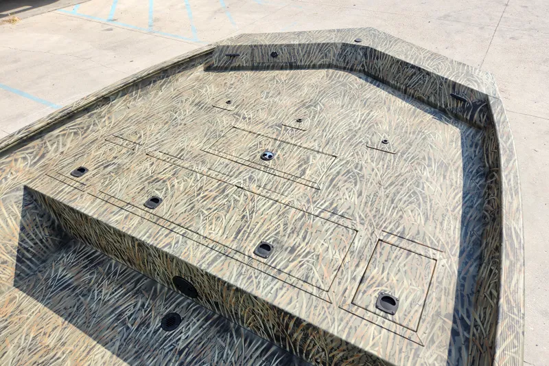 Slide: The Image of 2025 Tracker Grizzly 2072 CC boat with camouflage pattern on deck. - 12