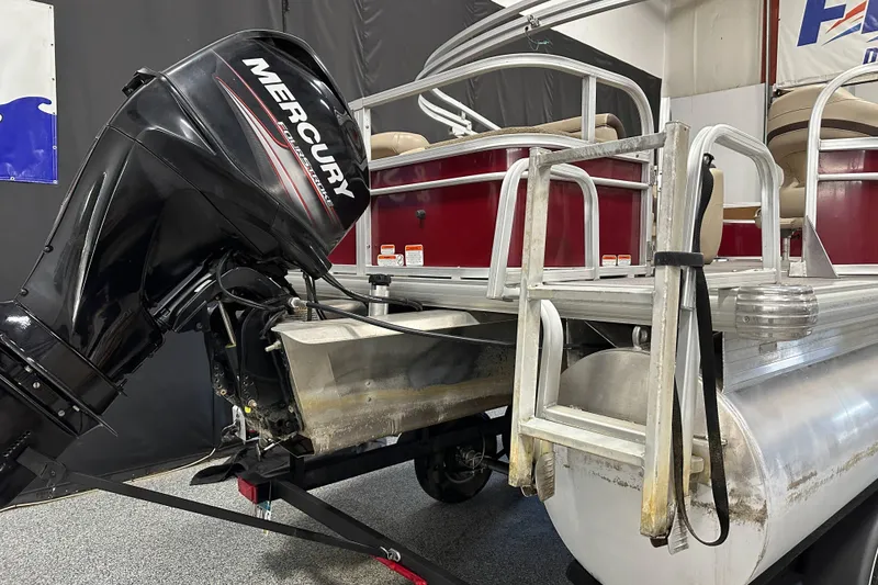 Slide: The Image of 2018 Sun Tracker SFB20 pontoon boat with Mercury outboard motor in a showroom. - 10