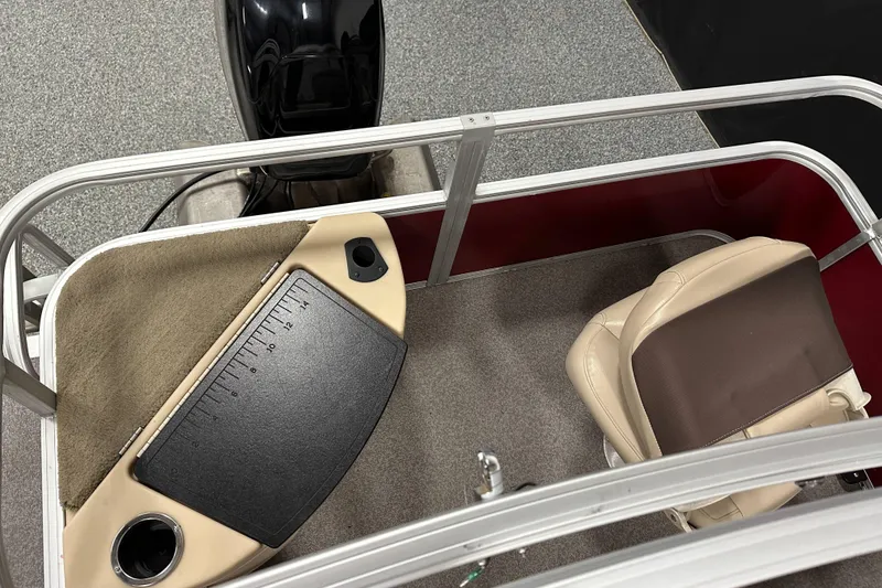 Slide: The Image of 2018 Sun Tracker SFB20 boat interior with seating and measuring board. - 19