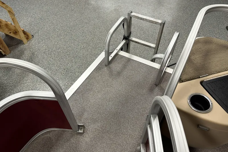 Slide: The Image of 2018 Sun Tracker SFB20 boat deck with ladder and cup holder. - 20