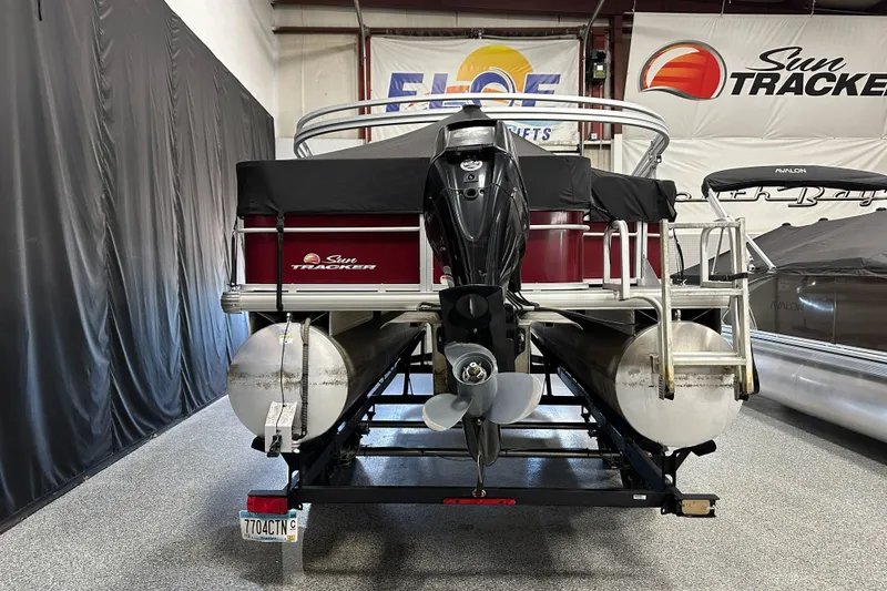 Slide: The Image of 2018 Sun Tracker SFB20 pontoon boat with outboard motor in showroom. - 4