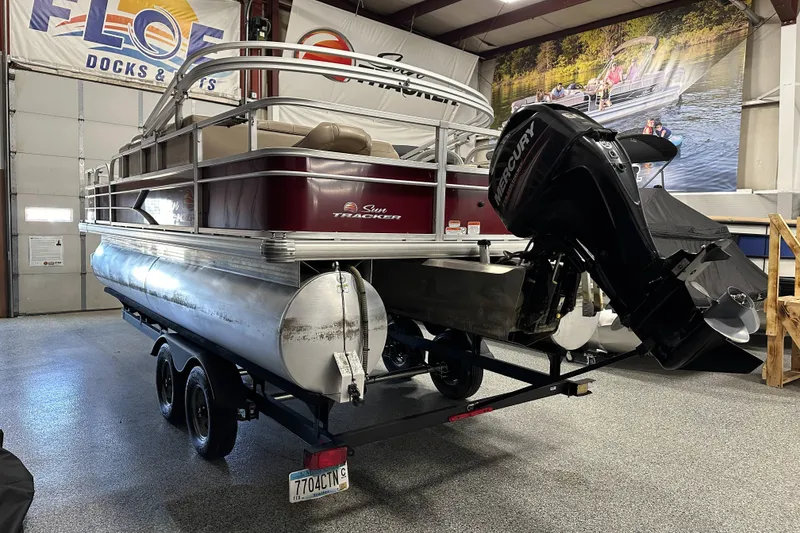 Slide: The Image of 2018 Sun Tracker SFB20 pontoon boat on trailer in showroom. - 6