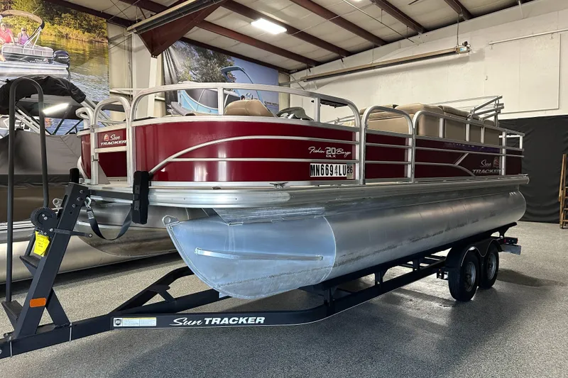 Slide: The Image of 2018 Sun Tracker SFB20 pontoon boat on trailer in indoor showroom. - 7