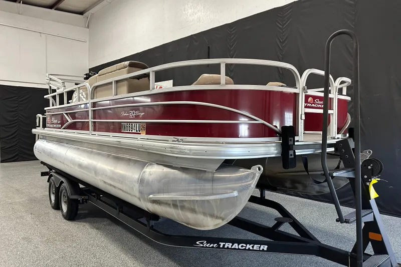 Slide: The Image of 2018 Sun Tracker SFB20 pontoon boat on trailer in indoor storage. - 8