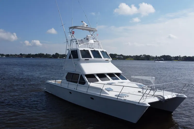 Slide: The Image of Voyager 44 yacht from 2000 on calm waters under a clear sky. - 10