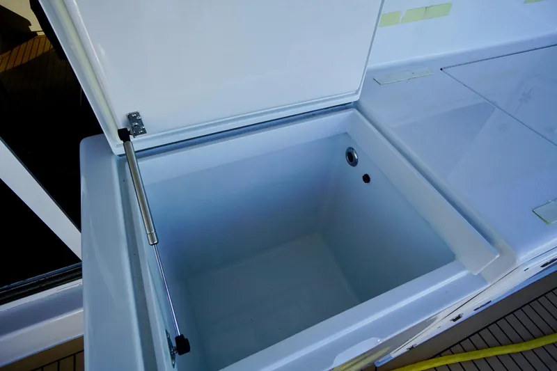 Slide: The Image of Open storage compartment on 2000 Venturer 44 boat, featuring a spacious interior. - 101