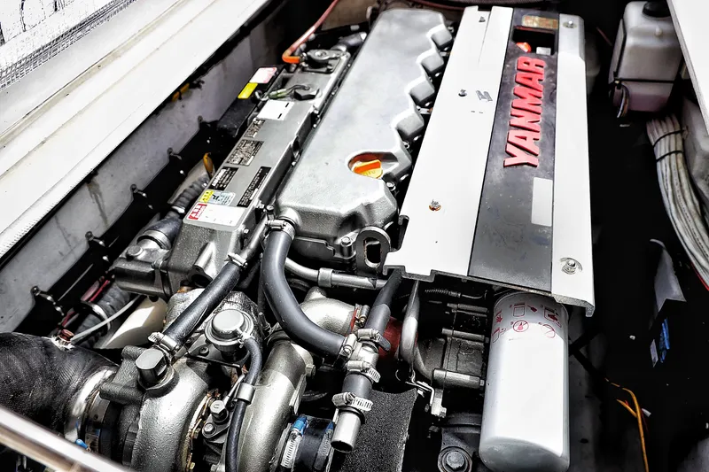 Slide: The Image of Engine of a 2000 Venturer 44 boat, featuring a Yanmar diesel engine. - 108