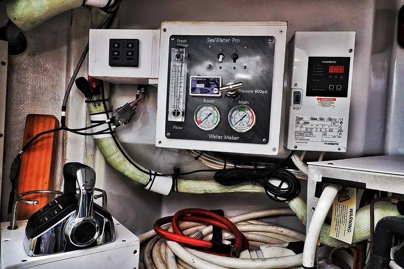 Slide: The Image of Control panel of a 2000 Venturer 44 boat with water maker system. - 109