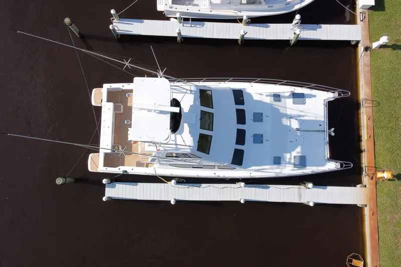Slide: The Image of Aerial view of a 2000 Voyager 44 yacht docked at a marina. - 36