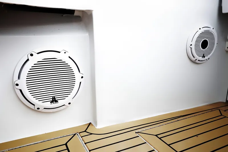 Slide: The Image of Speakers on a 2000 Venturer 44 boat with teak-style flooring. - 41