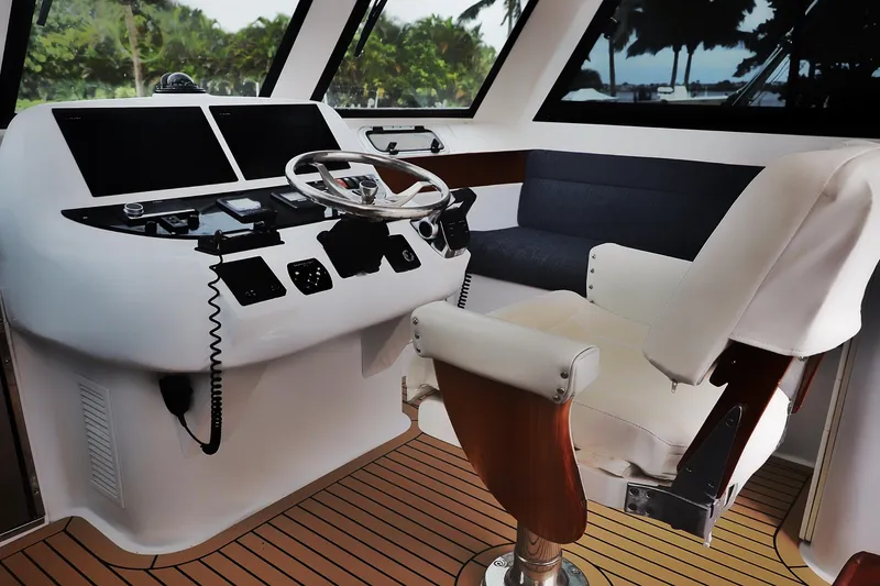 Slide: The Image of Helm of 2000 Venturer 44 yacht with modern controls and comfortable seating. - 43