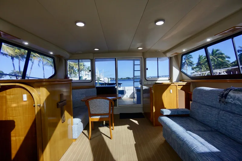 Slide: The Image of Interior of 2000 Venturer 44 yacht with wooden furnishings and ocean view. - 63
