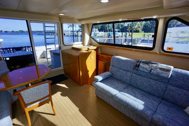 Slide: The Image of Luxurious interior of 2000 Venturer 44 yacht with scenic waterfront view. - 64