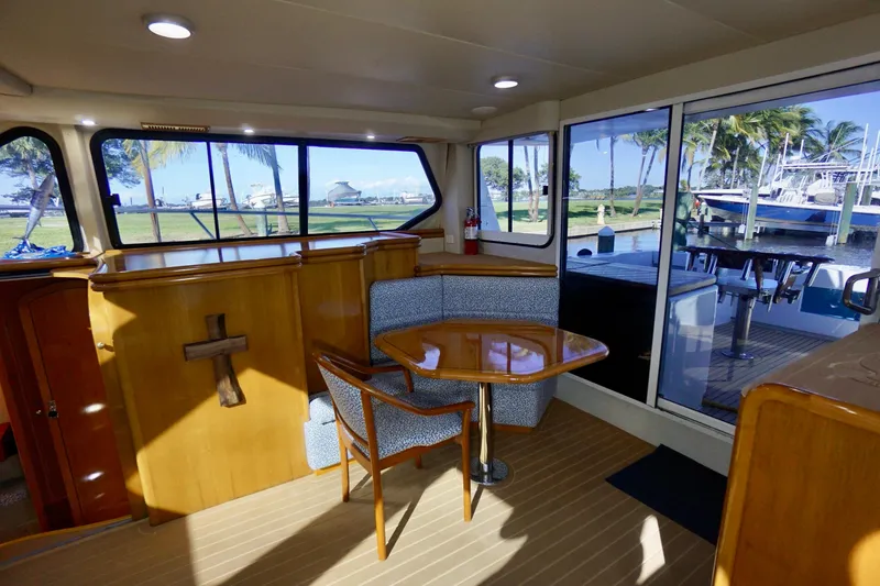 Slide: The Image of Interior of 2000 Venturer 44 yacht with dining area and large windows. - 66