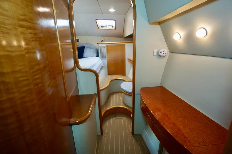 Slide: The Image of Luxurious interior of 2000 Venturer 44 yacht with wood finishes and cozy cabin. - 68