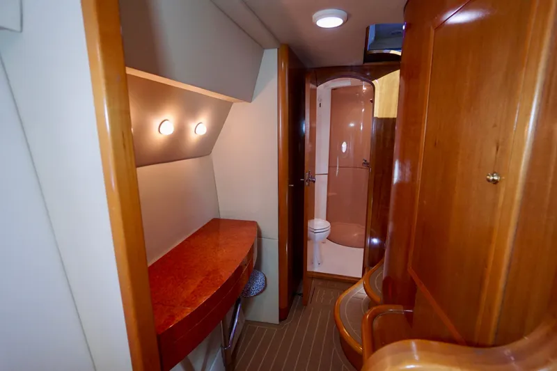 Slide: The Image of Luxurious interior of 2000 Venturer 44 yacht featuring wood finishes and modern amenities. - 71