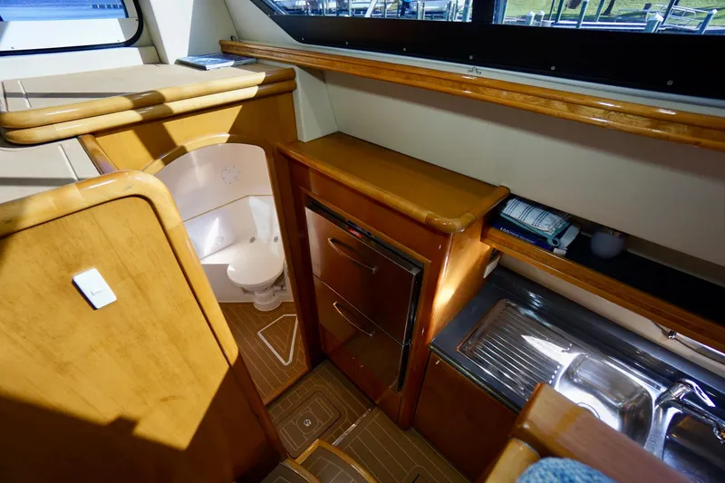 Slide: The Image of Interior of 2000 Venturer 44 yacht with wooden cabinetry and compact bathroom. - 73