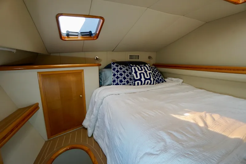 Slide: The Image of Cozy cabin interior of 2000 Venturer 44 yacht with bed and skylight. - 77