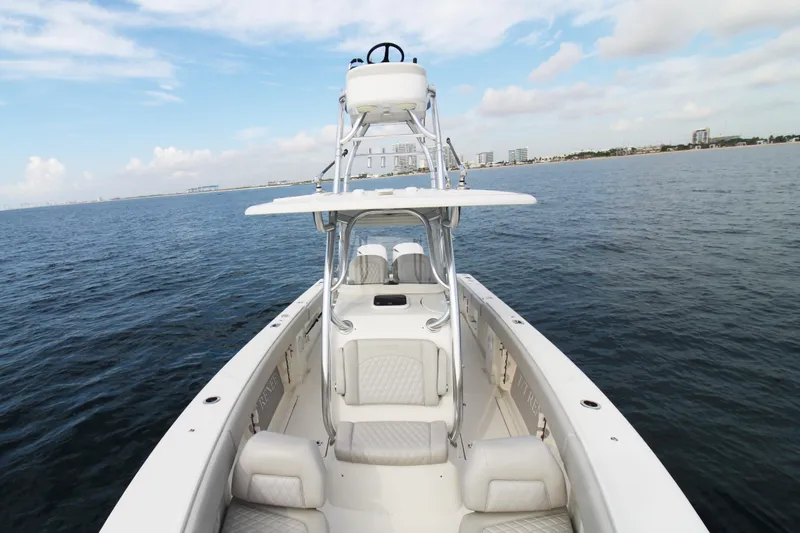 Slide: The Image of 2019 Jupiter 30 HFS boat on open water with city skyline in background. - 10
