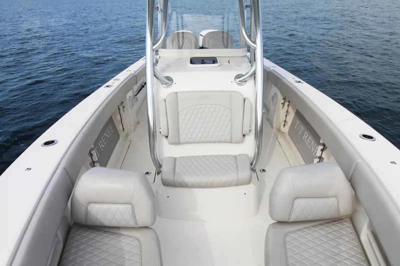 Slide: The Image of 2019 Jupiter 30 HFS boat interior with cushioned seating on calm water. - 11