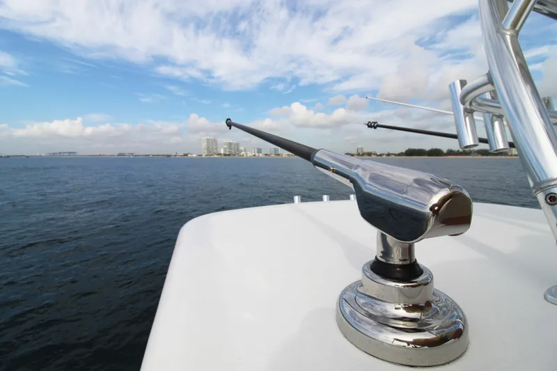 Slide: The Image of 2019 Jupiter 30 HFS boat with fishing rod holder on open water. - 13