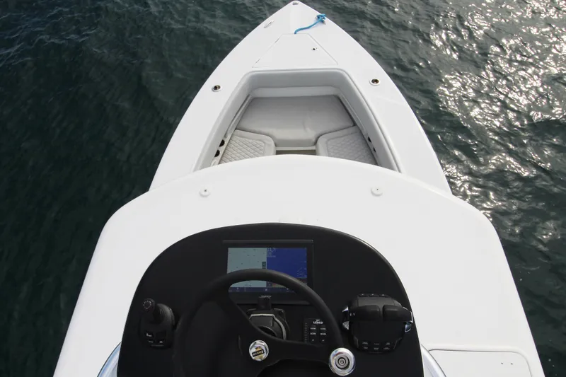 Slide: The Image of 2019 Jupiter 30 HFS boat dashboard and bow on water. - 15