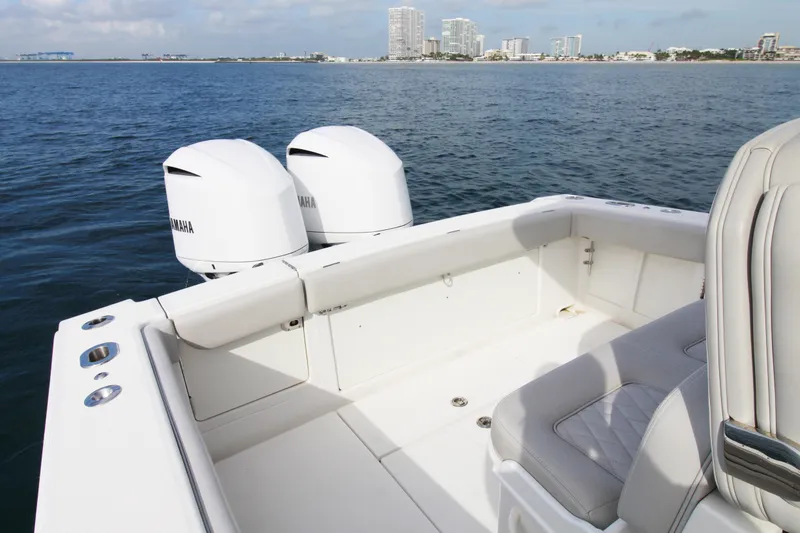 Slide: The Image of 2019 Jupiter 30 HFS boat with dual Yamaha engines on calm water. - 18