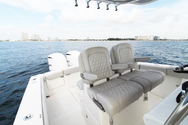Slide: The Image of 2019 Jupiter 30 HFS boat interior with luxurious seating on open water. - 6