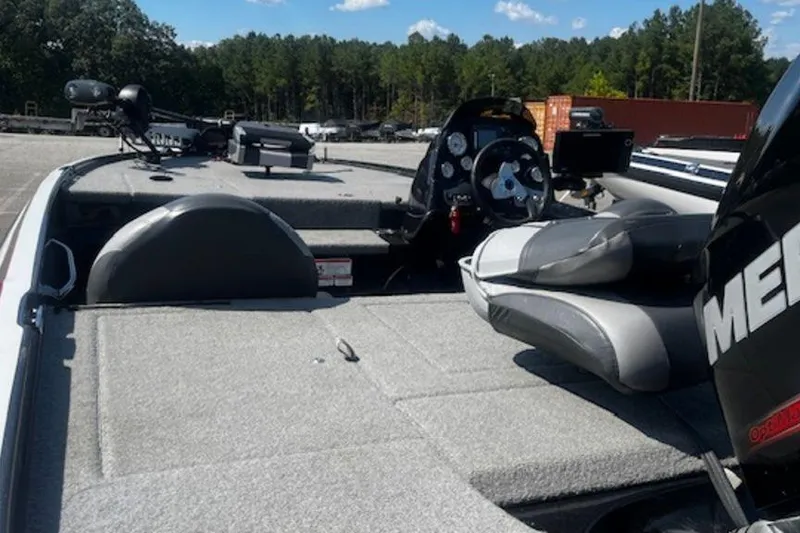 Slide: The Image of 2013 Nitro Z Series Z-6 boat interior with steering console and seating. - 2