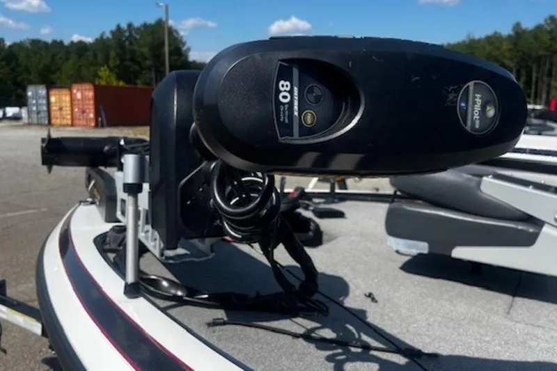 Slide: The Image of 2013 Nitro Z Series Z-6 boat with trolling motor in a parking lot. - 3