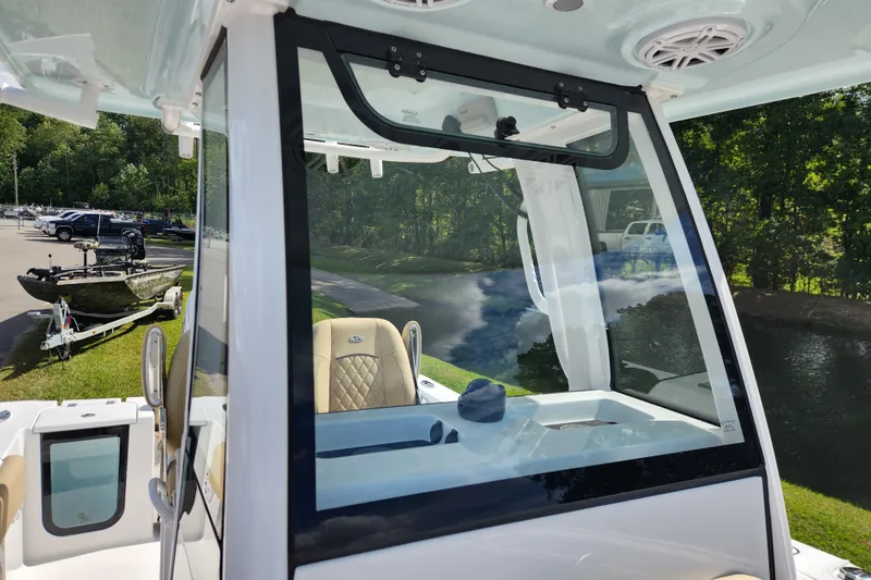 Slide: The Image of 2026 Sportsman Open 232 Center Console boat with sleek design and modern features. - 11