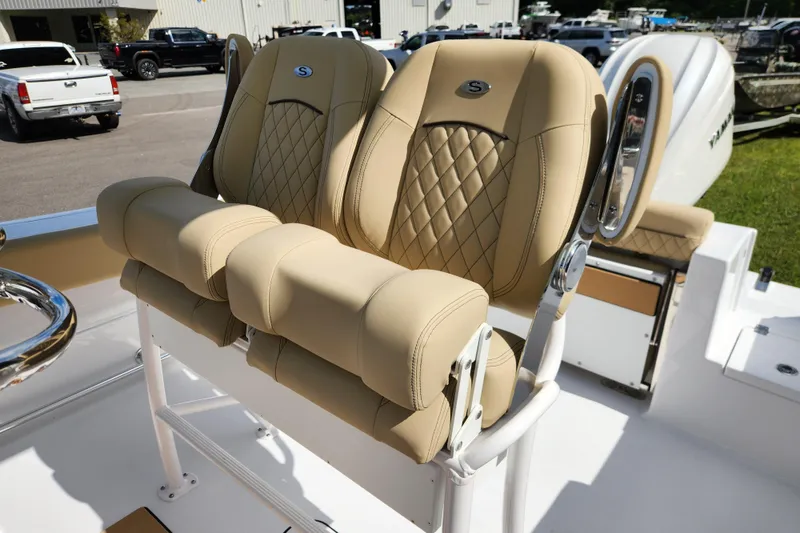 Slide: The Image of Luxurious seating on 2026 Sportsman Open 232 Center Console boat, featuring tan upholstery. - 15