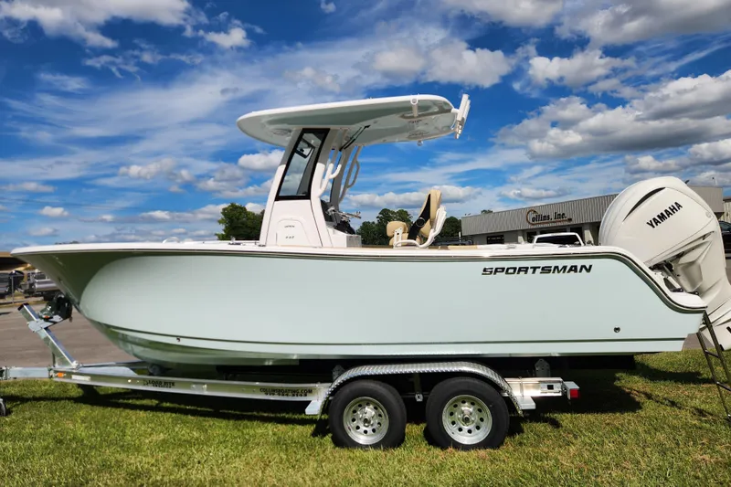 Slide: The Image of 2026 Sportsman Open 232 Center Console boat on trailer under blue sky. - 5