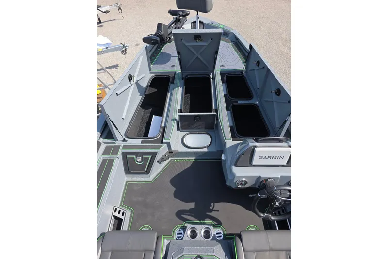 Slide: The Image of Interior view of 2026 Xpress XR21 boat with open storage compartments and Garmin equipment. - 11