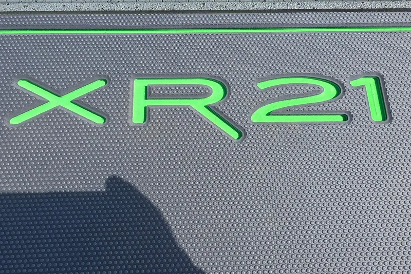 Slide: The Image of Text "XR21" in green on textured gray surface, Xpress model 2026. - 13