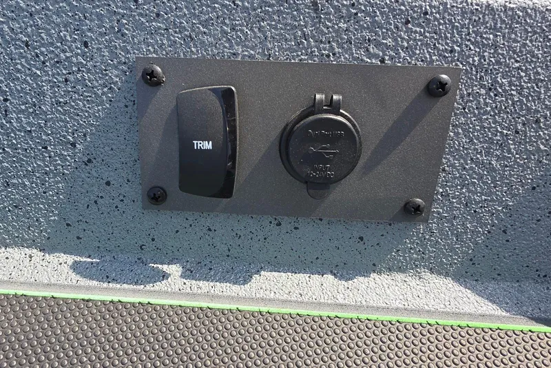 Slide: The Image of Boat control panel with trim switch and USB input on Xpress XR21, 2026 model. - 17